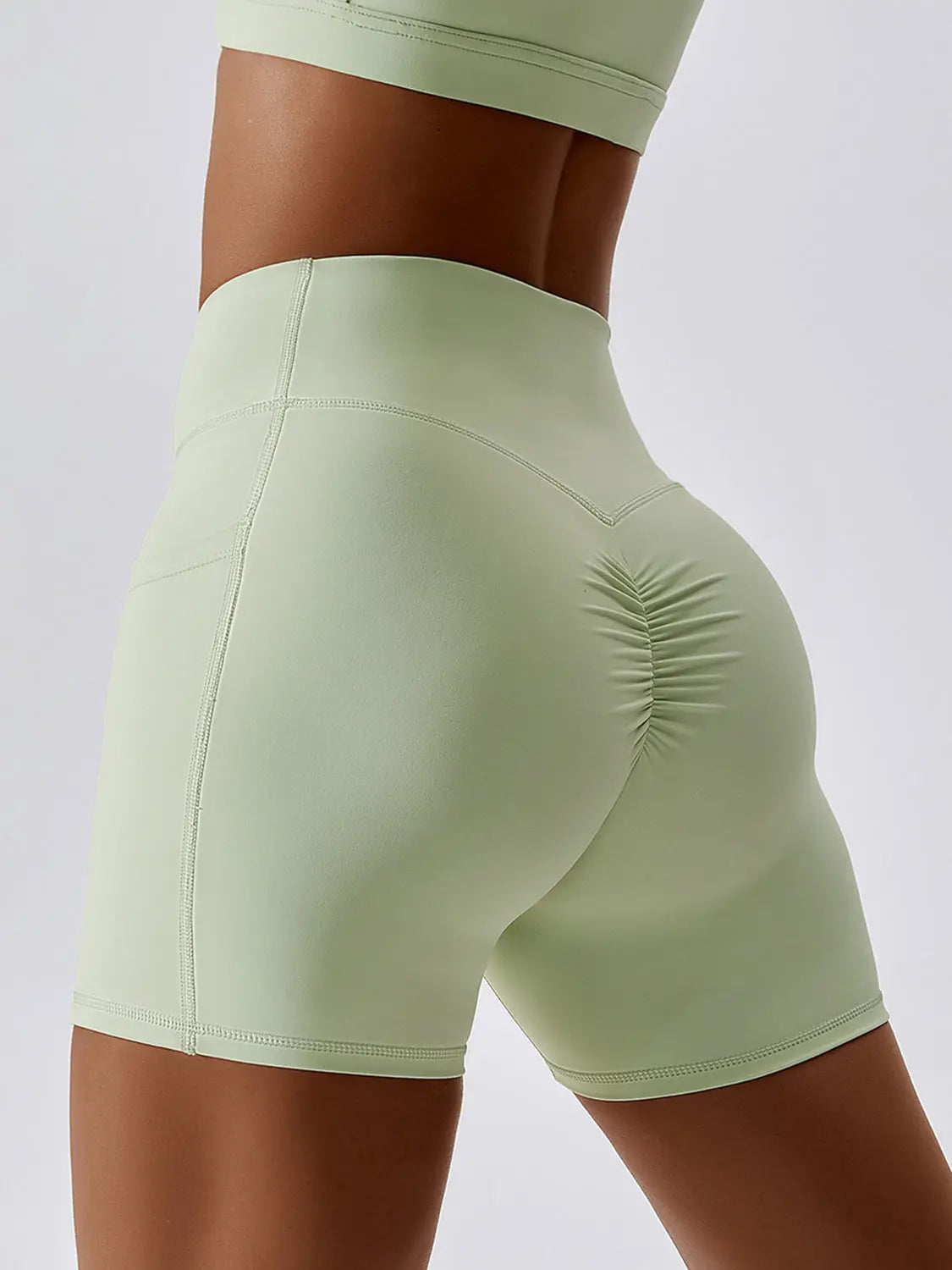 Ruched Pocketed High Waist Active Shorts Trendsi