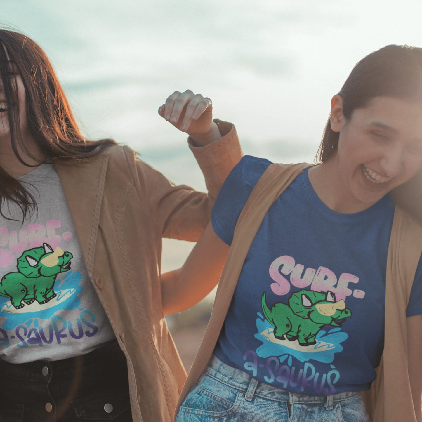 Surf A Saurus Dino Surfing Unisex Jersey Short Sleeve V-Neck Tee