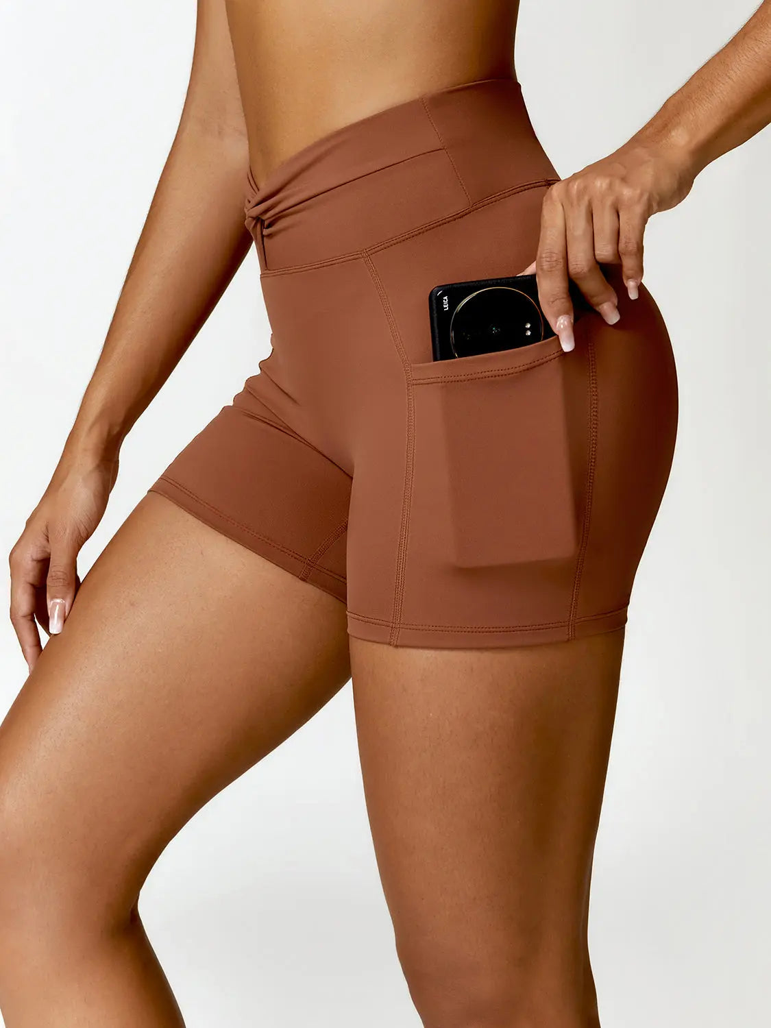 Twisted High Waist Active Shorts with Pockets Trendsi