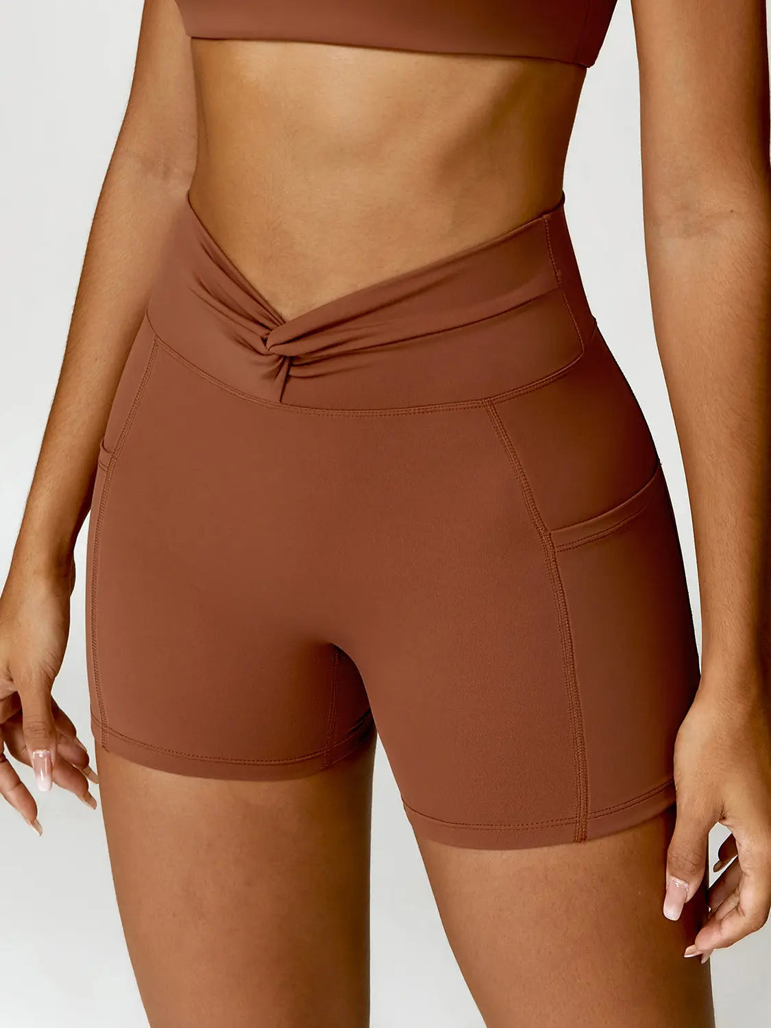 Twisted High Waist Active Shorts with Pockets Trendsi