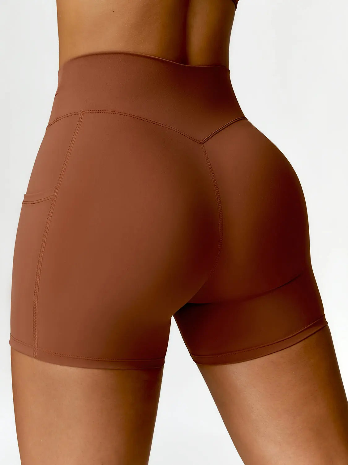 Twisted High Waist Active Shorts with Pockets Trendsi