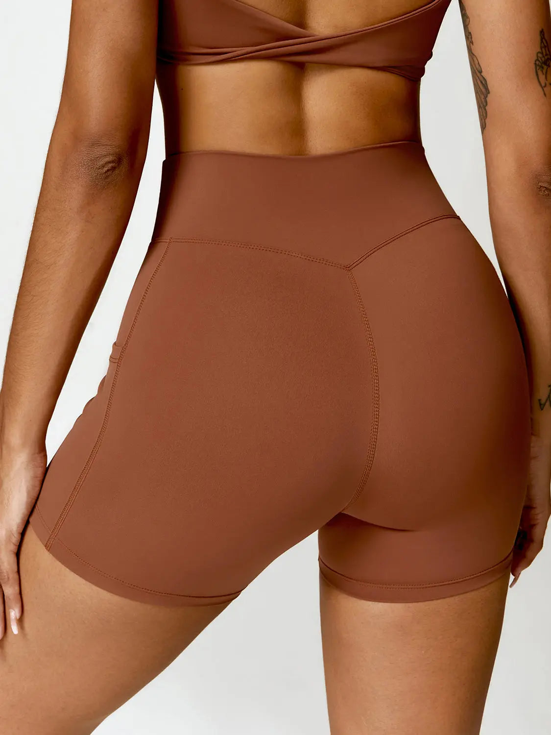 Twisted High Waist Active Shorts with Pockets Trendsi