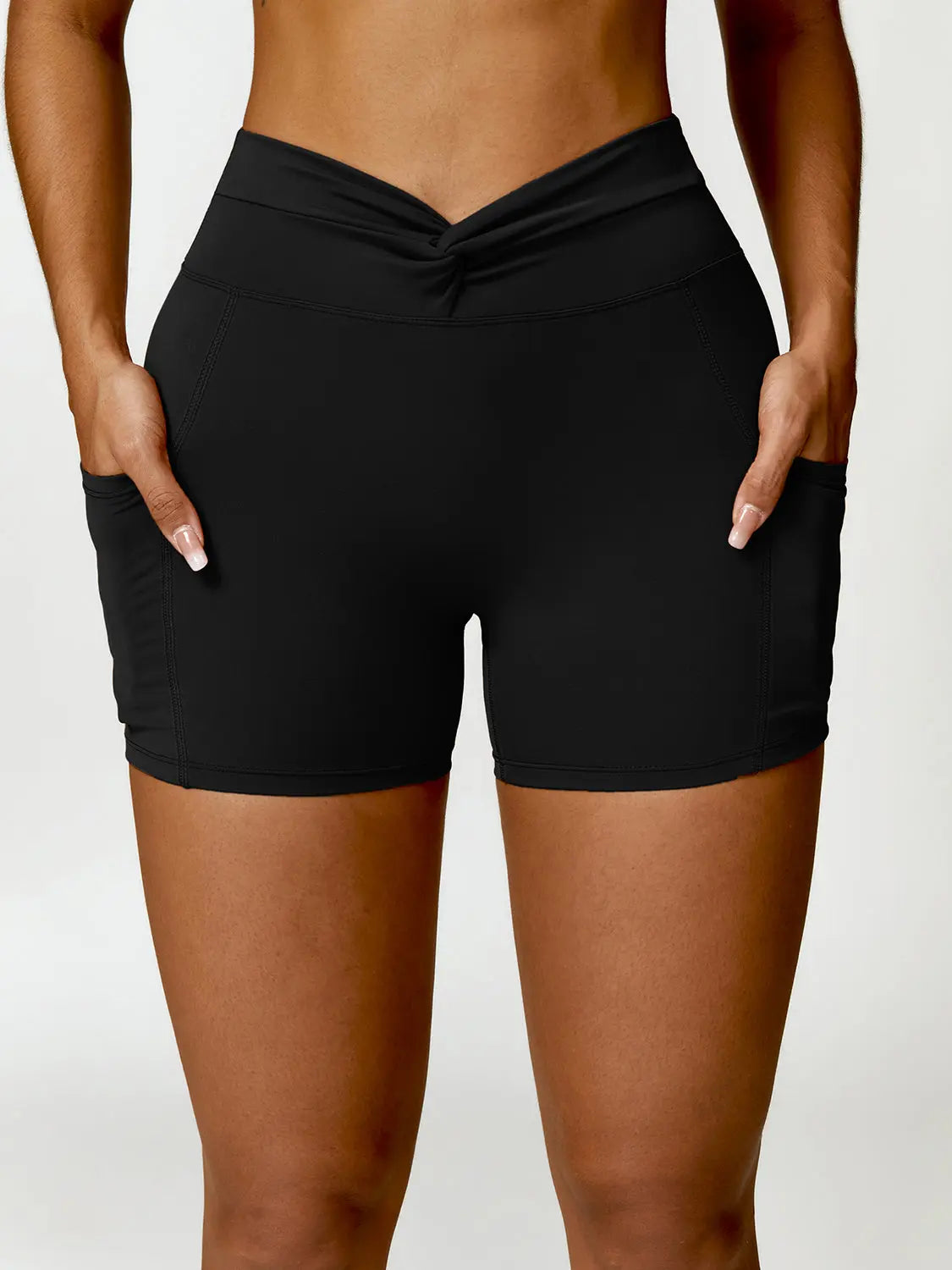 Twisted High Waist Active Shorts with Pockets Trendsi