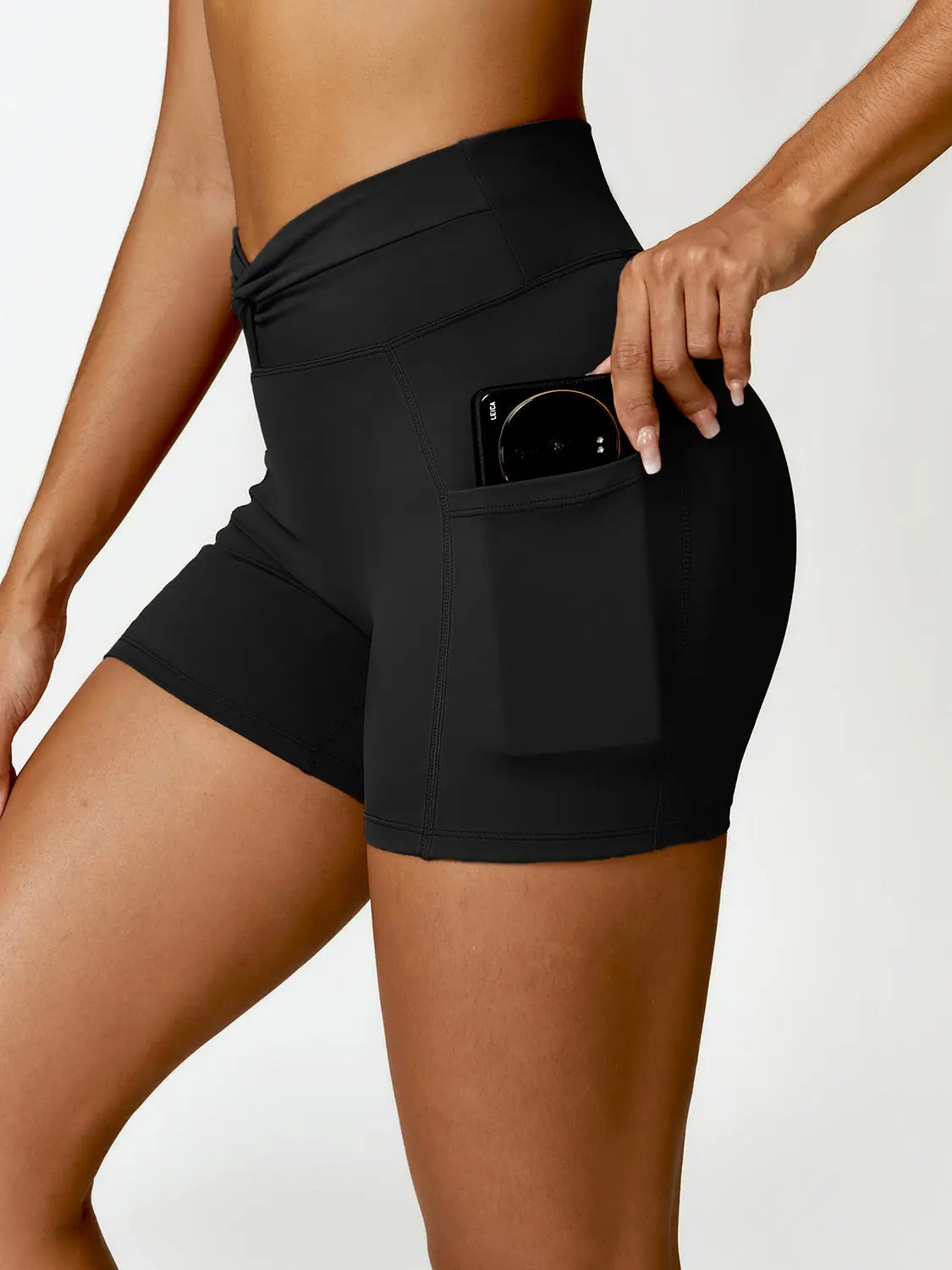 Twisted High Waist Active Shorts with Pockets Trendsi